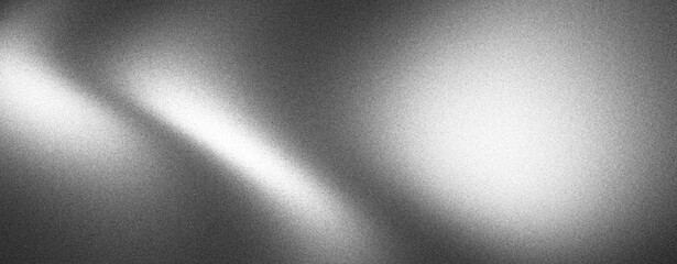 Obraz premium Abstract grayscale background with diagonal light streak and textured surface.
