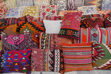 Colourful cushions on display for sale in a traditional Turkish Bazaar.
