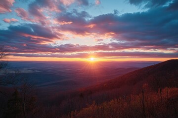 Obraz premium stunning sunset over rolling hills and valleys
