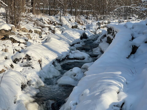 A river in a mountainous area in winter. A stormy stream. - Powered by Adobe
