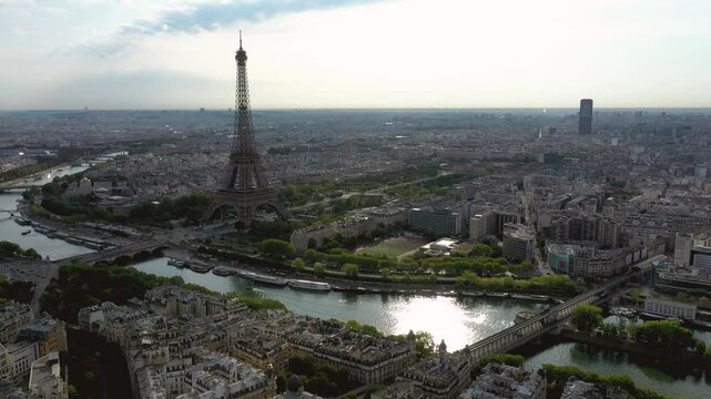 Paris, France - October 3, 2024: Aerial view of the Eiffel Tower and Seine River bustling with activity and charm