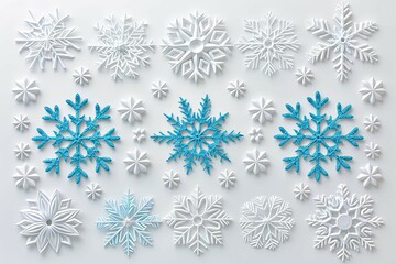 Decorative snowflakes of various designs arranged on a white surface showcasing a festive winter theme for seasonal celebrations