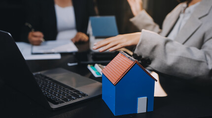 Close up Business people or Real Estate agent explain signing agreement for sale house to client....