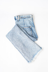 Top view of old jeans fashion folded isolated on white background with clipping path. Flat lay 