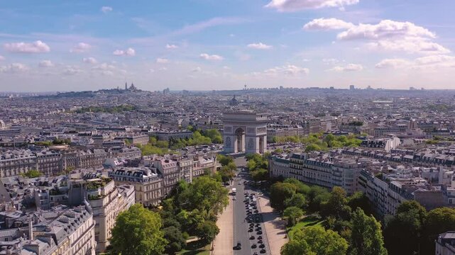 PARIS, FRANCE - OCTOBER 3, 2024: Stunning aerial view captures the beauty of the Arc de Triomphe and Parisian skyline under a clear sky