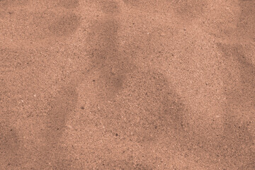 Mocha mousse color 2025 sandy beach texture background