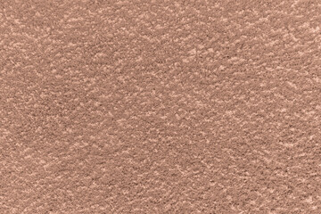 Mocha mousse 2025 color. Brown mocha mousse clay concrete plaster textured wall background.  