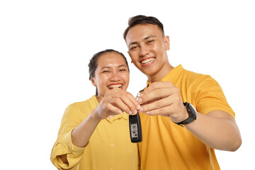 Happy Asian couple smiling cheerful while showing motorbike keys