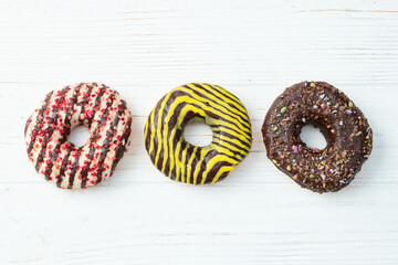 Sweet glazed colorful donuts . Top view