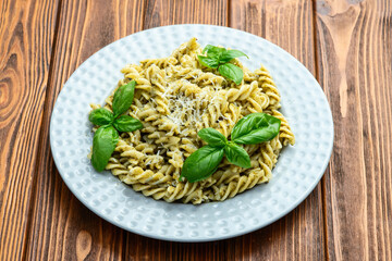 Pasta with basil sauce pesto . Italian food photography . Top view