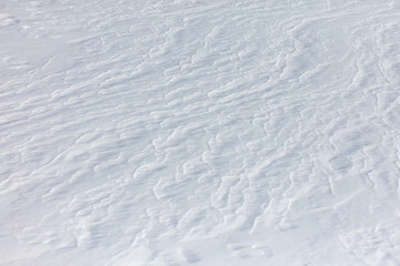 The snow is white and the ground is covered in it