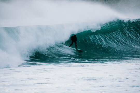 Surfer Riding a Barrel Wave at Unstad