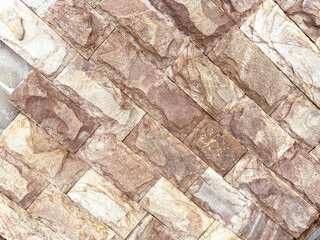 A brick wall with a brown and tan color