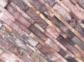 A brick wall with a brown and tan color