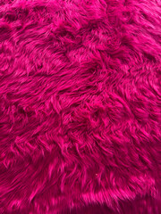 A close up of a pink fur texture