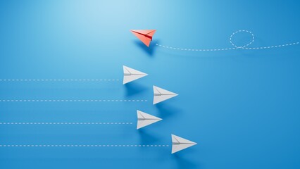 group of blue paper planes are sailing in one direction, one red is sailing in the opposite direction. The concept of an extraordinary personality, to act contrary to the foundations of society