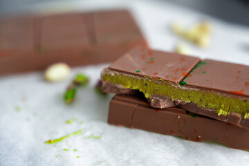 Trend Dubai chocolate with pistachio paste and kataifi dough. Confectionery handmade sweets at home in the kitchen. 