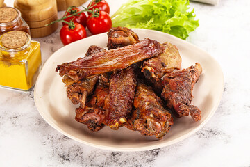 Roasted duck wings with sauce