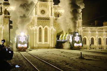 Christmas train with steam locomotive and illumination