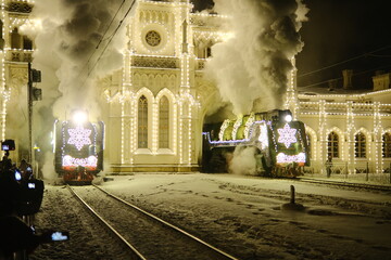 Christmas train with steam locomotive and illumination