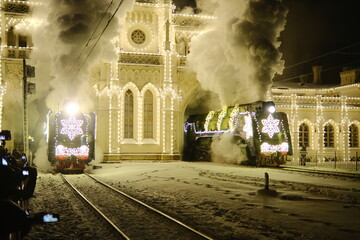 Christmas train with steam locomotive and illumination