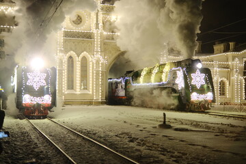 Christmas train with steam locomotive and illumination