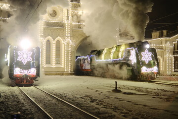 Christmas train with steam locomotive and illumination