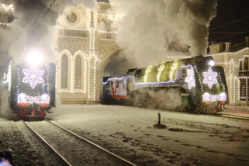 Christmas train with steam locomotive and illumination