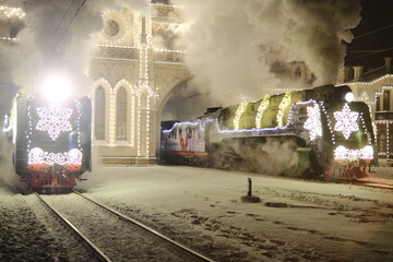 Christmas train with steam locomotive and illumination