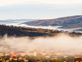 Cluj county cityscape city travel in autumn season surrounded by fog and mist