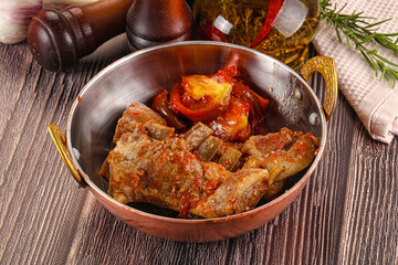 Baked lamb ribs with vegetables