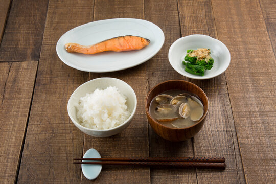 Breakfast of white rice, miso soup with Asari Clam, grilled salmon and boiled rape blossoms