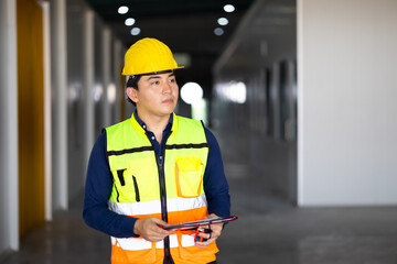 Portrait Asian male. Warehouse staff Employees worker standing by goods shelf working in large warehouse. transport and storage of goods. supply chain and delivery
