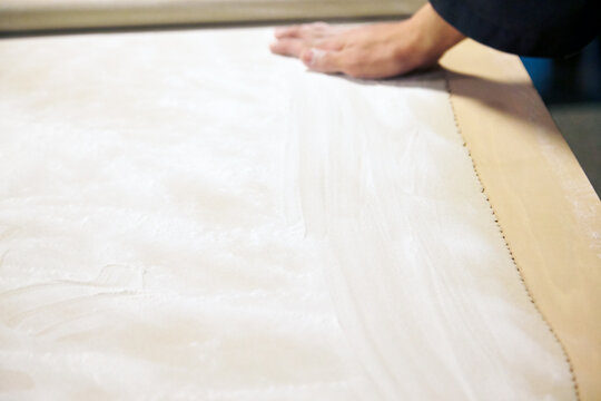 Photographs of stretching handmade buckwheat noodles, Soba