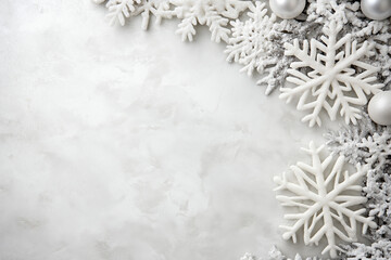 White snowflakes and ornaments on soft white background. Concept of winter and holiday decor.