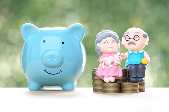 Mutual fund,Love couple senior and piggy bank with stack of coins money on natural green background, Save money for prepare in future and pension retirement concept
