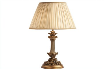 A vintage style table lamp with a brass base featuring ornate detailing and a pleated beige lampshade