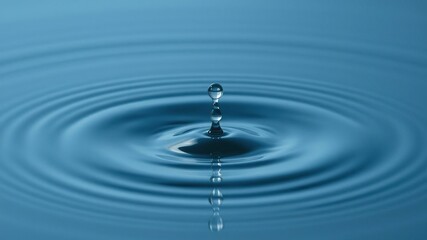 Droplet falls into calm water creating a small circle, nature, calm, aquatic