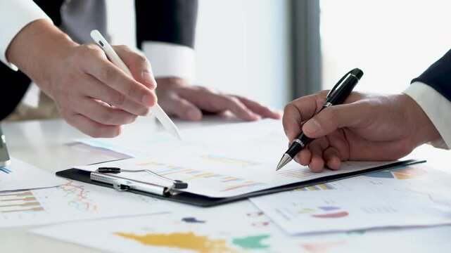 Team meeting focused on planning, strategy with data analysis for business growth financial feasibility fostering teamwork and organizational clarity.