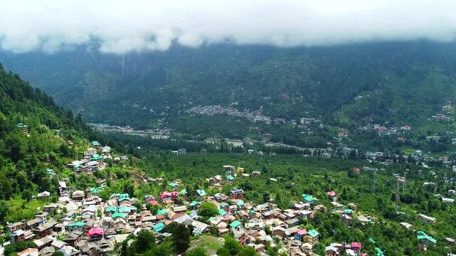Aerial view of manali with the beas river in himachal pradesh India. Himalayan mountains and colourful local houses nestled in the hills of manali himachal pradesh India.