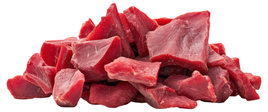 Pile of raw red meat chunks on a white background