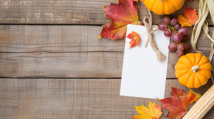 Obraz premium Happy Thanksgiving and blank card Autumn Harvest Celebration with Colorful Leaves, Pumpkins and Blank Card on Rustic Wooden Table Ready for Seasonal Decorations and Festive Invitations