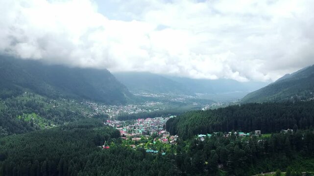 Aerial view of manali with the beas river in himachal pradesh India. Himalayan mountains and colourful local houses nestled in the hills of manali himachal pradesh India.