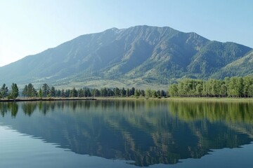 Naklejka premium Serene lake landscape with mountain backdrop reflecting tranquil scenery