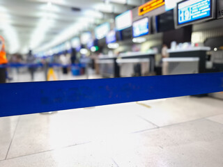 selective focus on the barrier tape for the check-in queue line at the airport