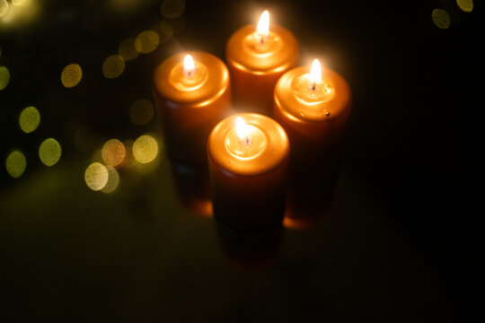 four burning candle for Advent and Christmas
