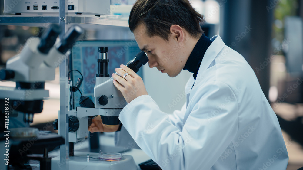 Poster molecular biology research scientist looking at a dna sample under a microscope in an applied scienc