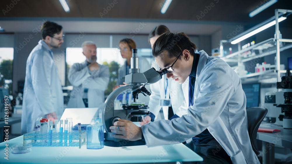 Poster Head of Laboratory Making a Bioengineering Experiment with a Group of Young Science College Students. Future Specialists Working with Modern Microscopes, Using Tablet and Laptop Computers
