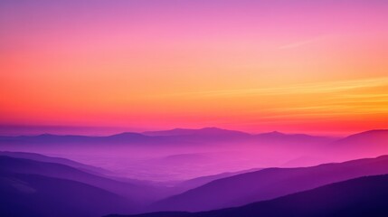 Obraz premium Vibrant Sunset Hues Over Silhouetted Mountain Ranges