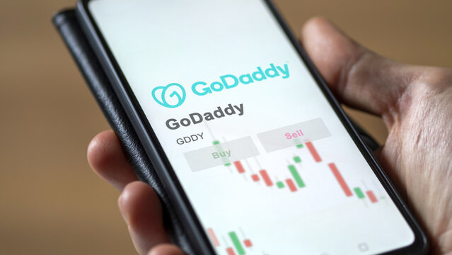 March 26th 2024, logo of GoDaddy on a white wall in a hall building, the $GDDY brand indoor.